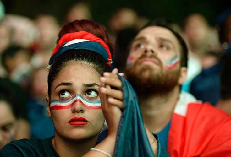 A French supporter reacts after the Euro 2016 final football match between Portugal and France at the Champ-de-Mars fan zone in Paris on July 10, 2016. Ronaldo`s Portugal beat France 1-0 in Euro 2016 final. Photo: AFP