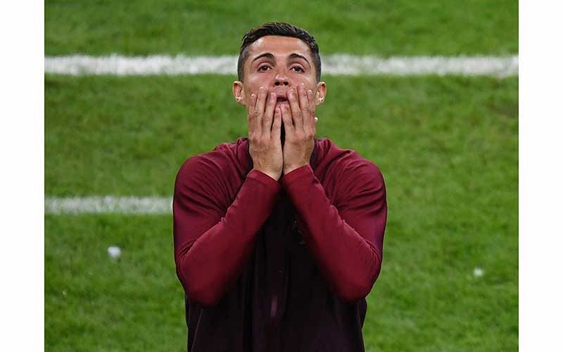 Portugal`s forward Cristiano Ronaldo reacts during the Euro 2016 final football match between Portugal and France at the Stade de France in Saint-Denis, north of Paris, on July 10, 2016. Photo: AFP