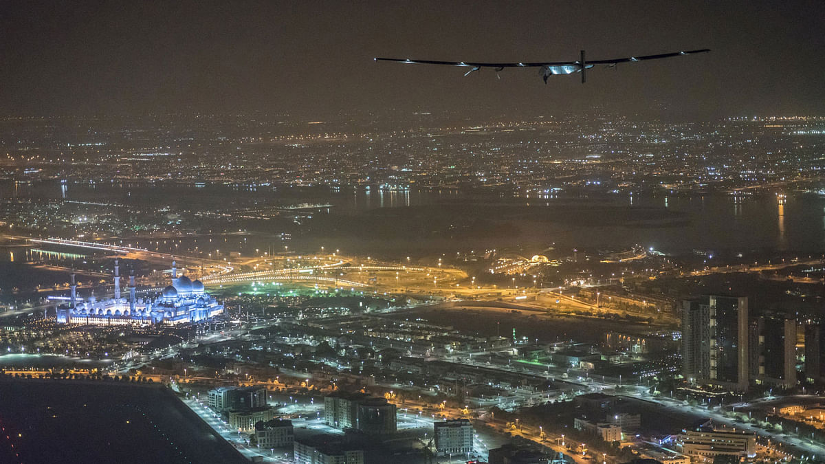 Solar Impulse 2, the solar powered plane, piloted by Swiss pioneer Bertrand Piccard, is seen before landing in Abu Dhabi, Dubai, UAE on Tuesday to finish the first around the world flight without the use of fuel. Photo: Reuters