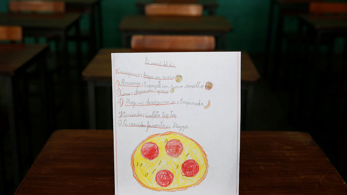 A drawing made during a lesson at a school shows what a student ate during the course of a day in Caracas, Venezuela. The student wrote, `Ate corn cake with cheese for breakfast; had spaghetti with egg for lunch and a cookie for dinner.` The student said that pizza was their favourite dish.