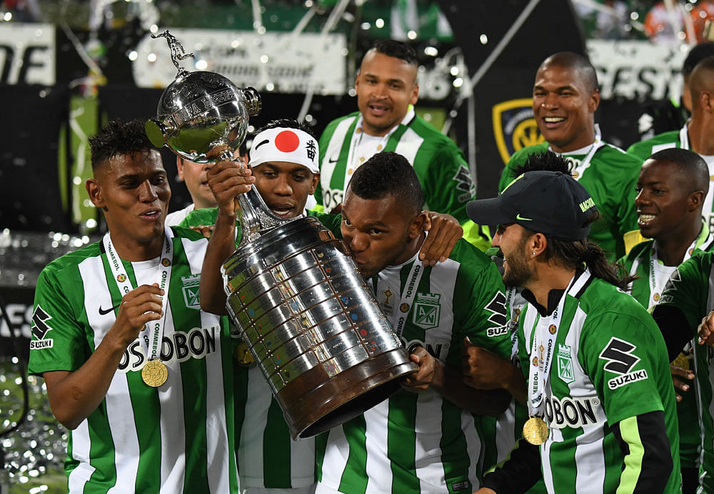 Colombia’s Atletico Nacional Miguel Borja kisses the trophy after winning the 2016 Copa Libertadores at Atanasio Girardot stadium, in Medellin, Antioquia department, Colombia. Photo: AFP