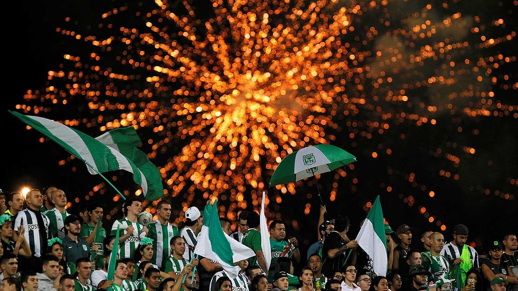 Fans of Atletico Nacional celebrate at the end of a second leg