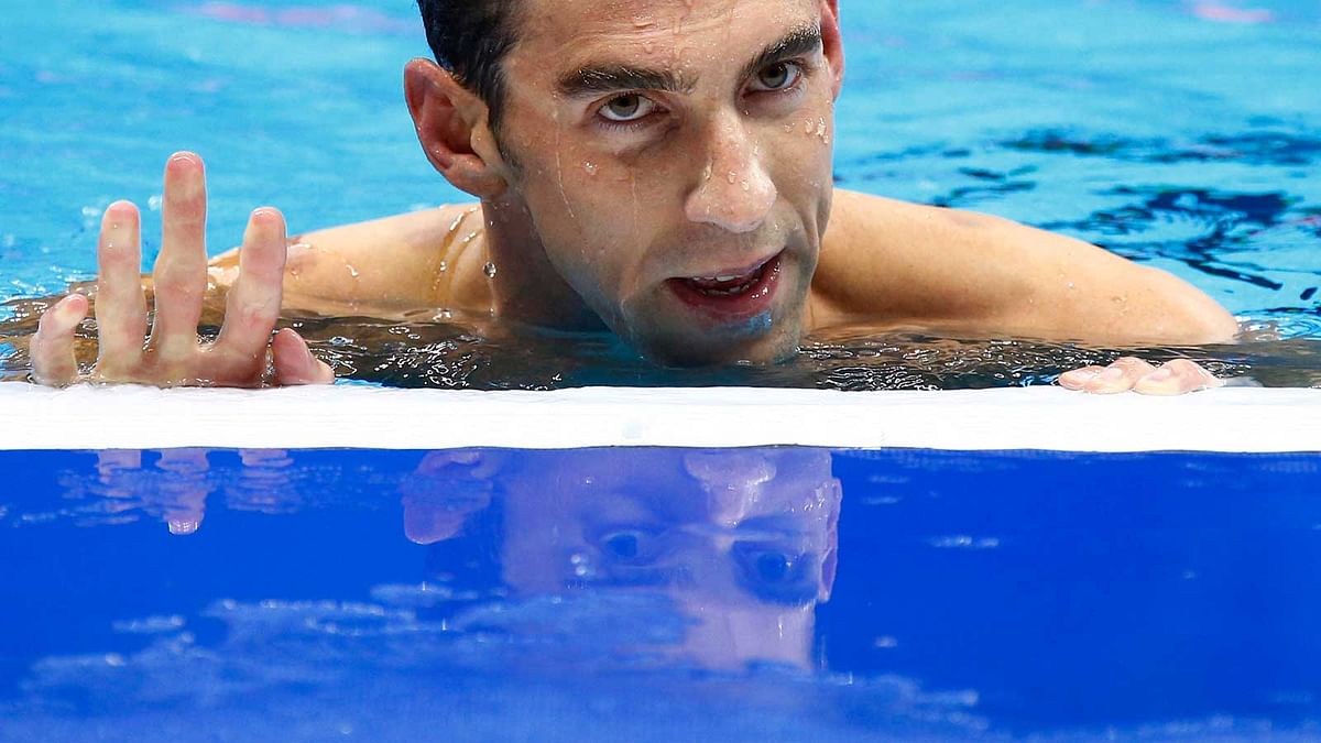 Michael Phelps (USA) of USA reacts after winning.