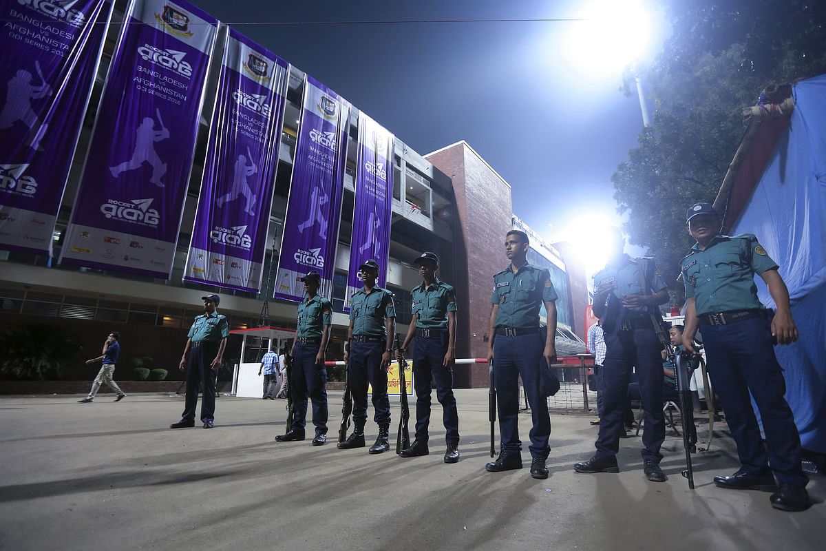 Bangladeshi police officials stand guard during the second One Day International (ODI) cricket match between Bangladesh and Afghanistan at the Sher-e-Bangla National Cricket Stadium in Dhaka on Wednesday. Photo: AFP