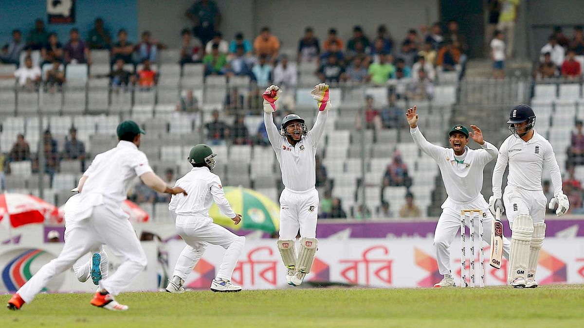 Bangladesh`s players celebrate the dismissal of England`s Ben Stokes on 29 October. Photo: Reuters