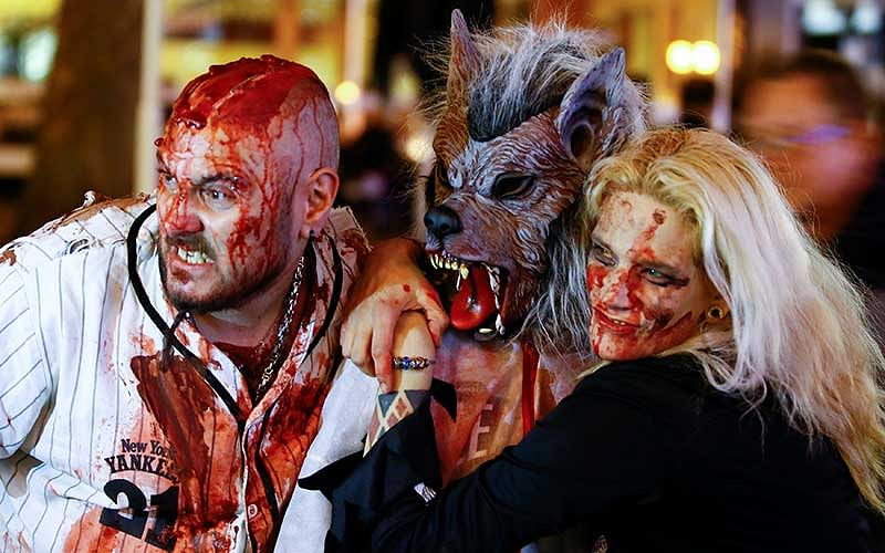 Revellers pose for pictures during the so-called `zombie walk` through the western German city of Essen on Halloween Day. Photo: Reuters