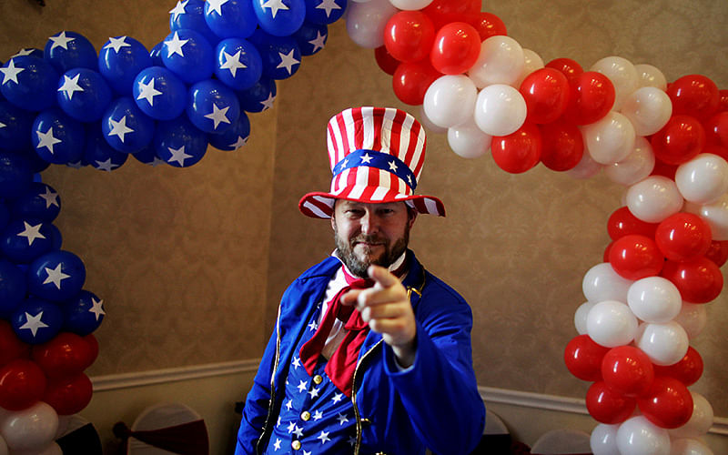 A man dressed as Uncle Sam attends an election night viewing party in San Salvador. Photo: Reuters