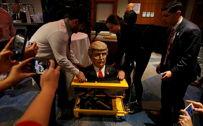 A cake in the form of Republican US presidential nominee Donald Trump is brought into the hotel where his election night rally will be held. Photo: Reuters