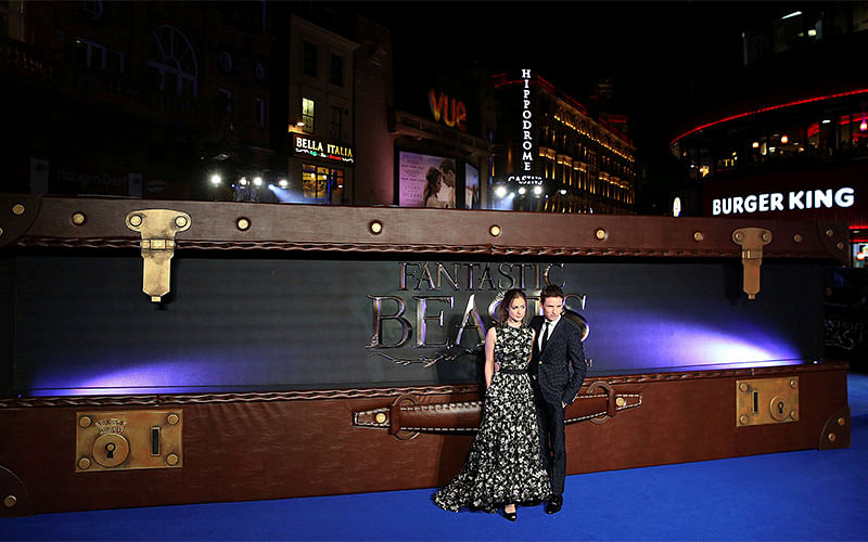 Actor Eddie Redmayne poses with Hannah Bagshawe as they arrive for the European premiere of the film `Fantastic Beasts and Where to Find Them` at Cineworld Imax, Leicester Square in London. Photo: Reuters