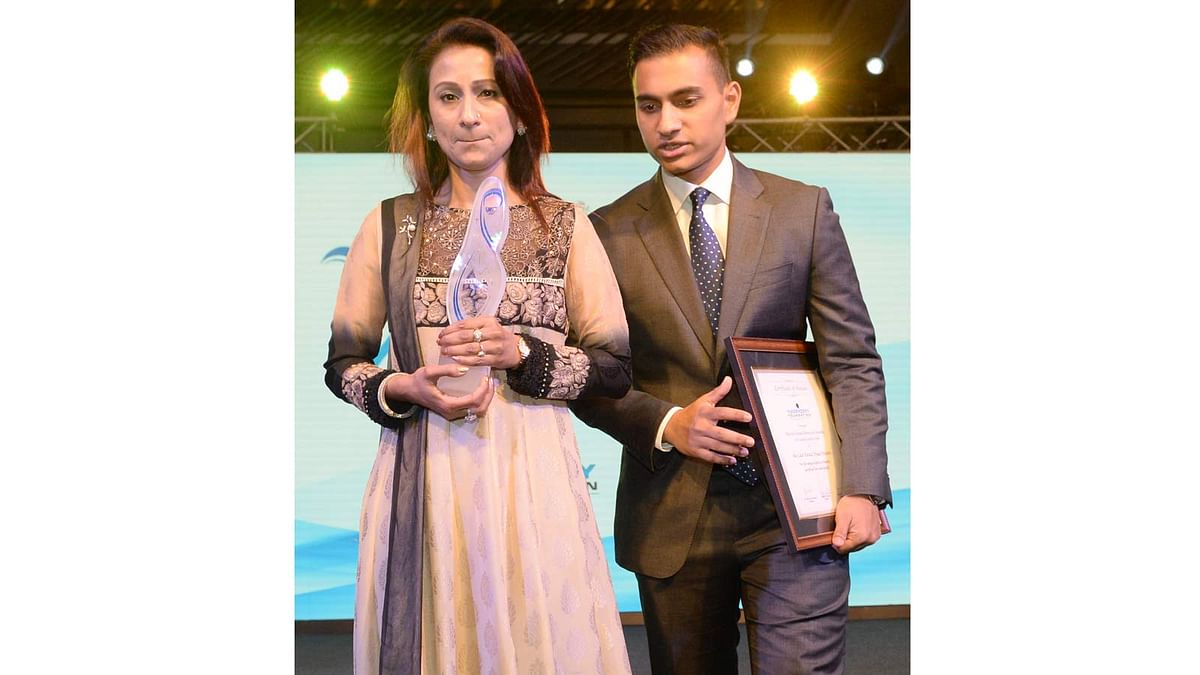 Simeen Hossain (L) and her elder son Zaraif are pictured after she received the Mother Teresa Memorial International Award for Social Justice 2016, on behalf of her son Faraaz Ayaaz Hossain who heroically gave his life during the Dhaka Cafe attack by extremists earlier this year, at an award ceremony in Mumbai on 20 November 2016. Photo: AFP