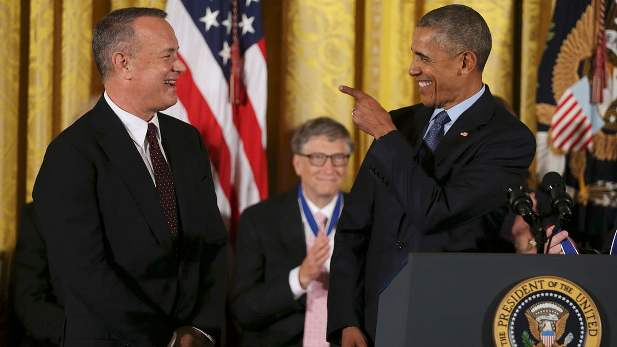 US President Obama reacts with actor Hanks before presenting the Presidential Medal of Freedom during White House ceremony in Washington. Photo: Reuters