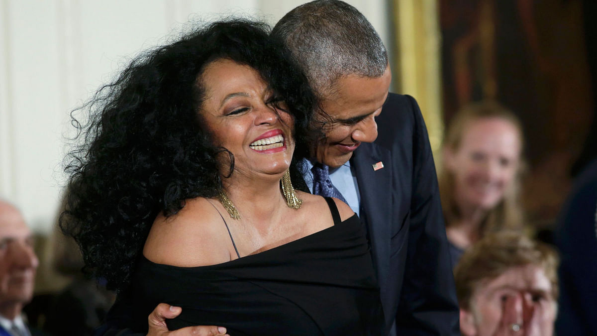Singer Ross is hugged by US President Obama before he awards her a Presidential Medal of Freedom during White House ceremony in Washington. Photo: Reuters