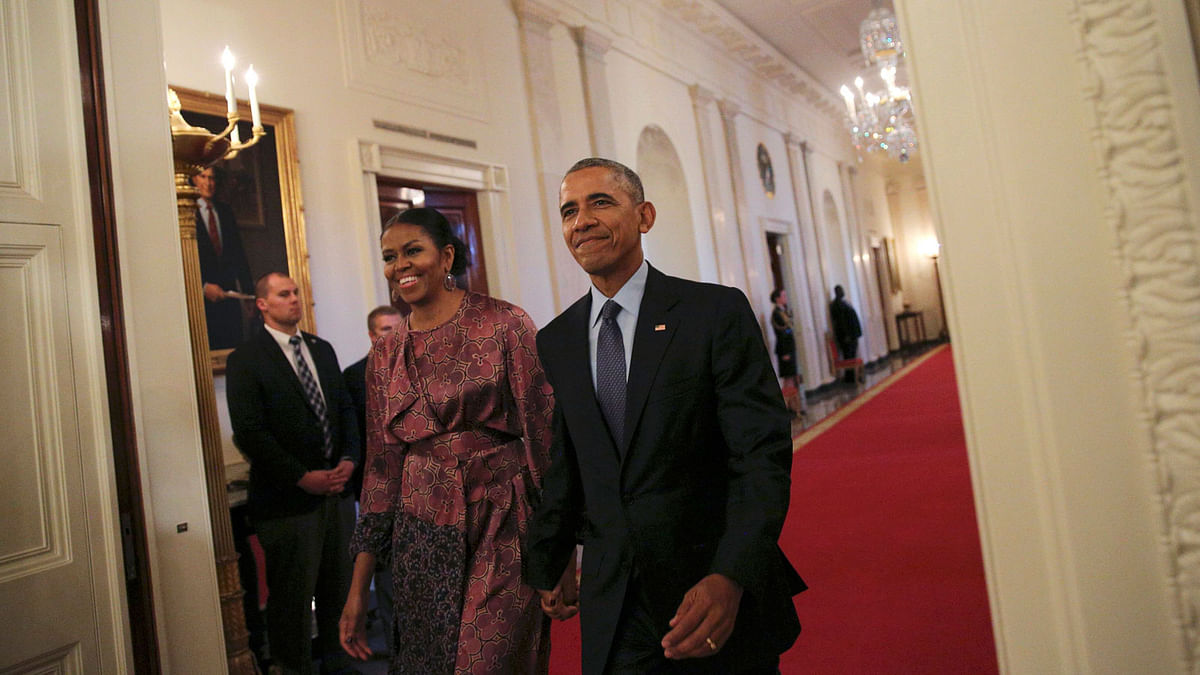 First lady Michelle Obama and US President Obama arrive prior to Presidential Medal of Freedom ceremony at the White House in Washington. Photo: Reuters
