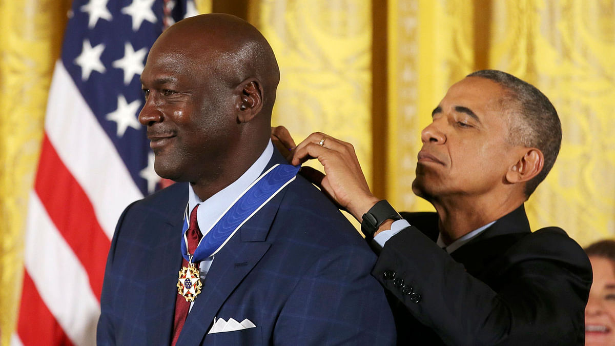 President Obama puts Presidential Medal of Freedom on NBA star Jordan at White House in Washington. Photo: Reuters