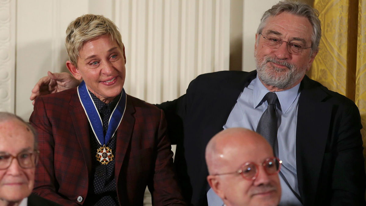 Actor De Niro puts his arm around a crying DeGeneres during Presidential Medal of Freedom ceremony at the White House in Washington. Photo: Reuters