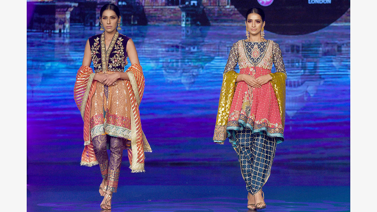 Models present creations by Pakistani fashion designer Wardha Saleem on the final day of the Fashion Bridal Couture Week in Lahore on November 27, 2016. Photo: AFP
