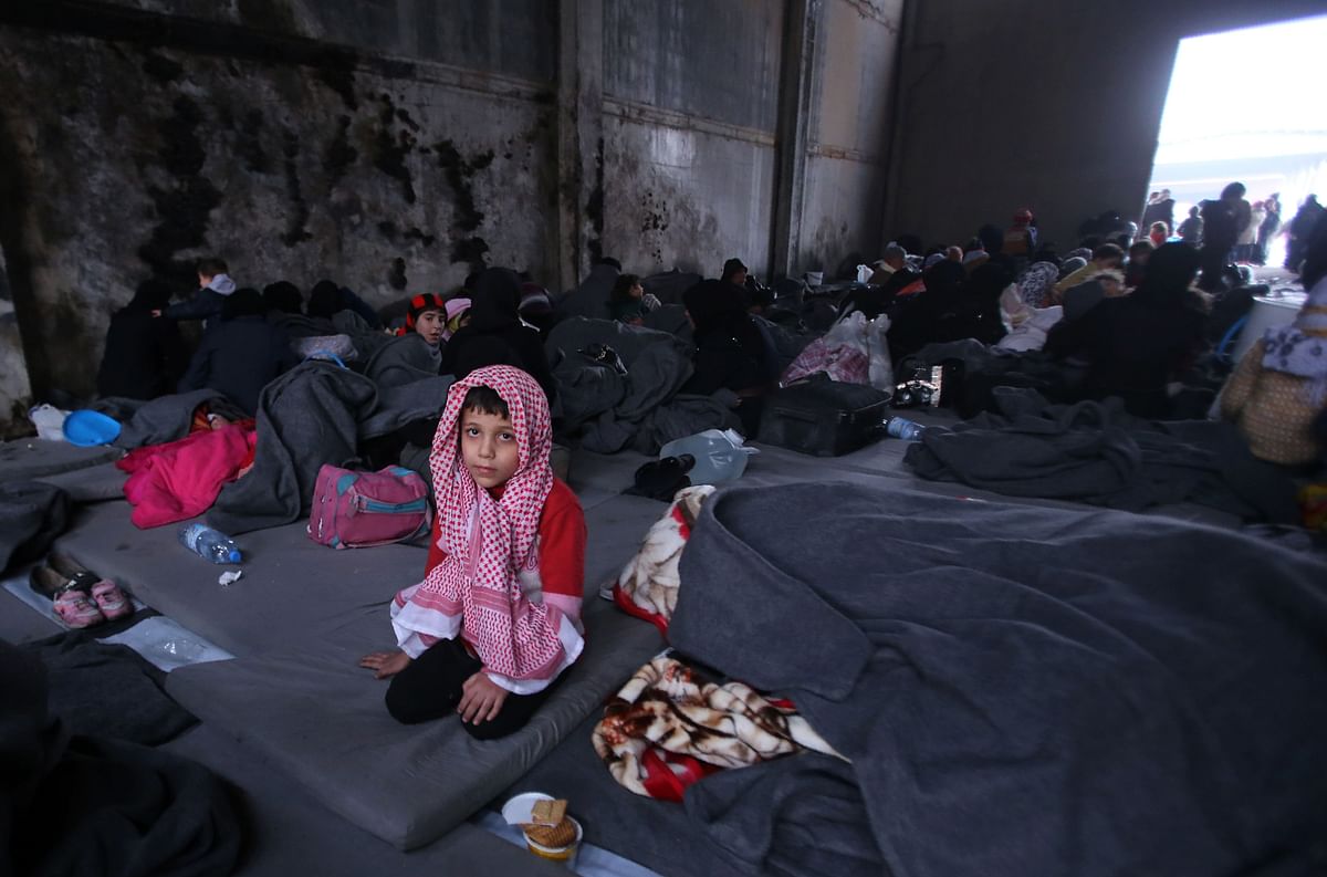 A Syrian boy, who fled with his family from rebel-held areas in the city of Aleppo, sits on November 30, 2016, inside a shelter in the neighberhood of Jibrin, east of Aleppo. Photo: AFP