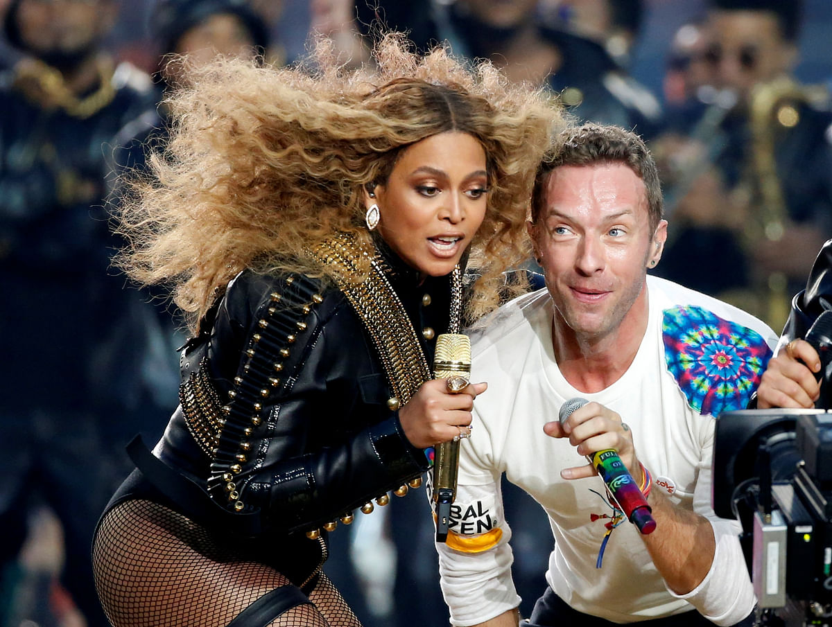Beyonce and Chris Martin of Coldplay perform during the half-time show at the NFL's Super Bowl 50 between the Carolina Panthers and the Denver Broncos in Santa Clara, California February 7, 2016. REUTERS