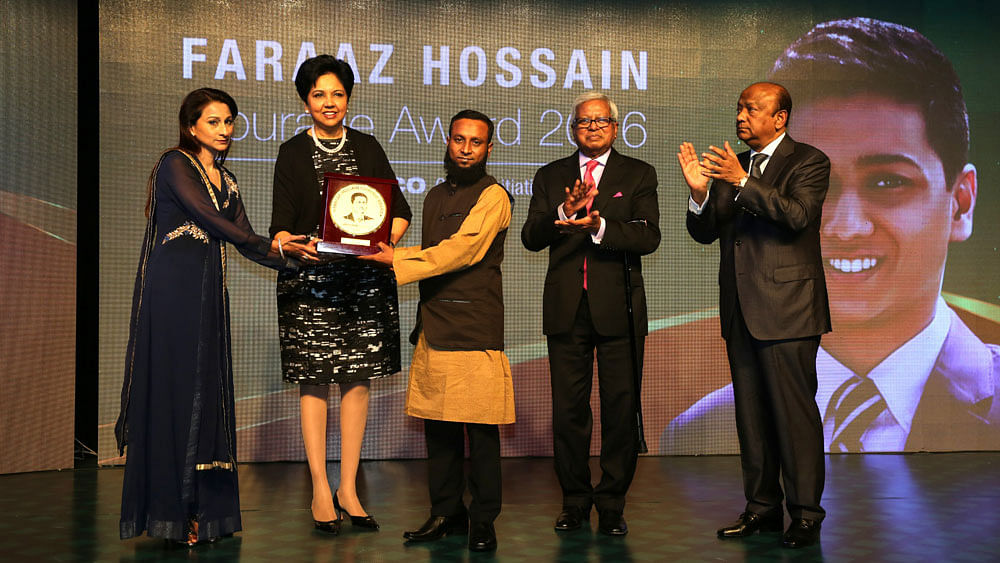 Chairman and CEO of Pepsico Global Indra K Nooyi hands over crest to Madaripur youth Md Miraz Sardar at the Faraaz Hossain Courage Award giving ceremony for an act of bravery. Faraaz’s mother Simeen Hossain is also seen at the ceremony. Photo: Zahidul Karim