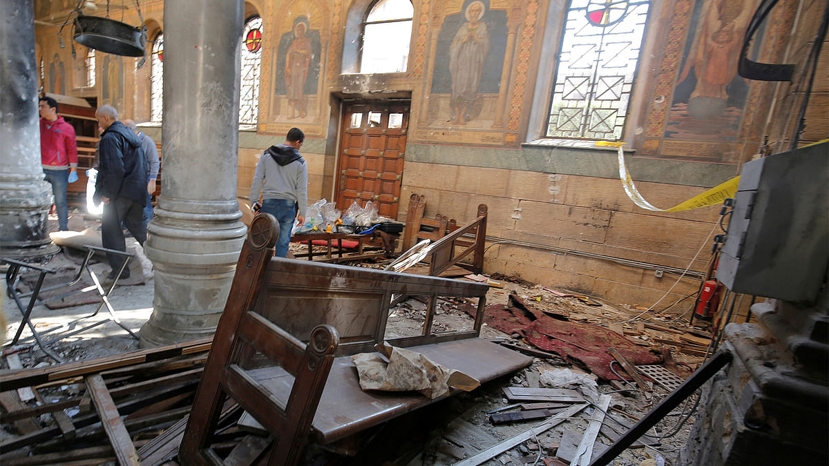 Egyptian security officials and investigators inspect the scene following a bombing inside Cairo`s Coptic cathedral in Egypt December 11, 2016. Photo: Reuters
