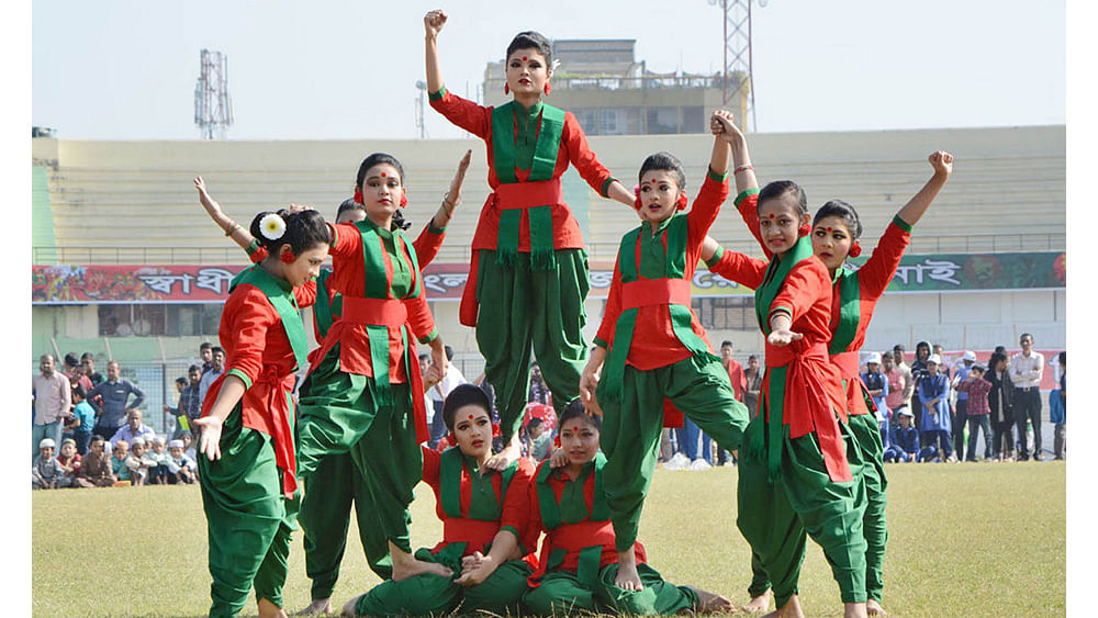Students perform on MA Aziz Stadium grounds celebrating the 46th Victory Day on Friday. Photo: Focus Bangla