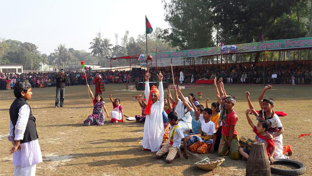 Students of the Nababganj Pilot High School in Dinajpur perform a drama on a Liberation War celebrating the 46th Victory Day on Friday. Photo: ASM Alamgir