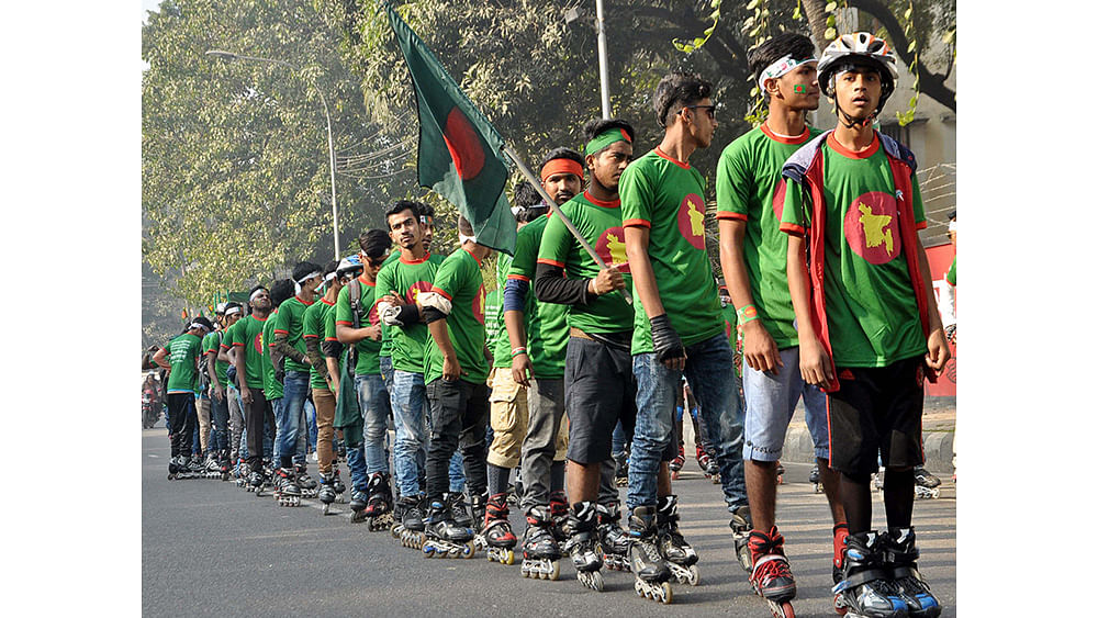 Skaters roll along the capital city road, celebrating the 46th Victory Day on Friday. Photo: Focus Bangla
