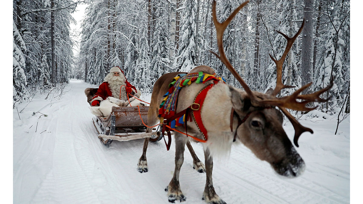 Santa Claus rides in his sleigh as he prepares for Christmas in the Arctic Circle near Rovaniemi, Finland. Photo: Reuters