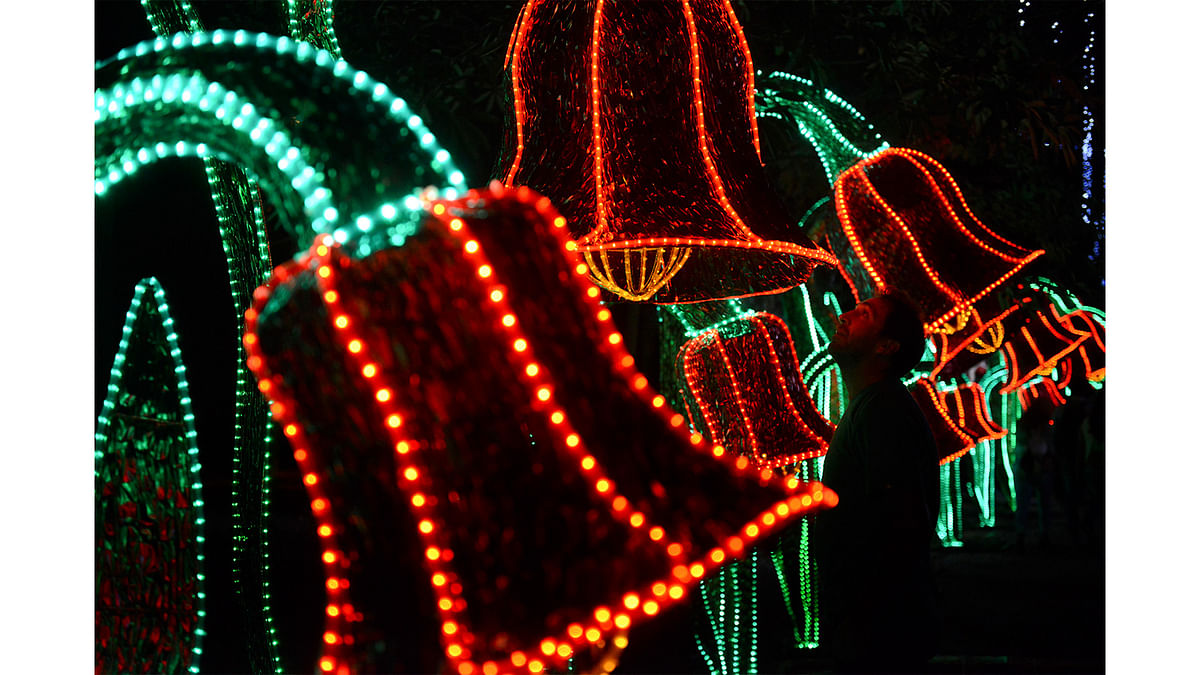 A man looks at a Christmas light display in Medellin, Antioquia department, Colombia. Photo: AFP