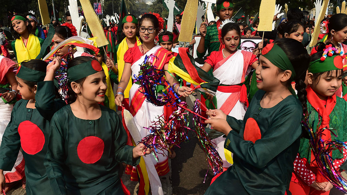 Bangladeshis take part in a parade to mark the country`s 45th Victory Day in Dhaka. Photo: AFP