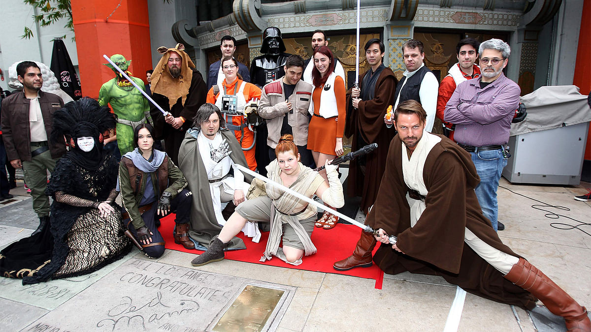 Fans pose for a photo after a costume contest of Star Wars fans lining up to see ‘Rogue One: A Star Wars Story’ at the TCL Chinese Theatre in Hollywood, California. Photo: AFP
