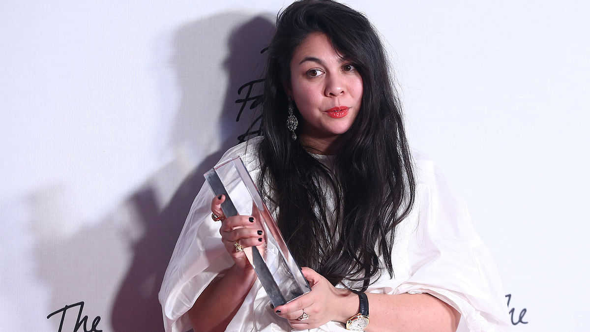 Simone Rocha, winner of the British Womenswear Designer award poses for photographers at the Fashion Awards 2016 in London, Britain December 5, 2016. Photo: Reuters