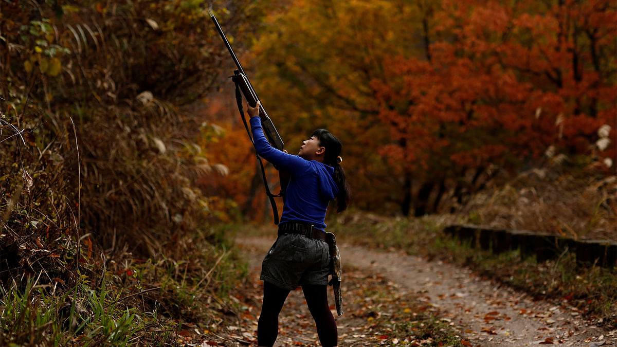 Hunter Masami Hata shoots at a duck in a forest outside Hakusan, Ishikawa Prefecture, Japan, November 20, 2016. Photo: Reuters