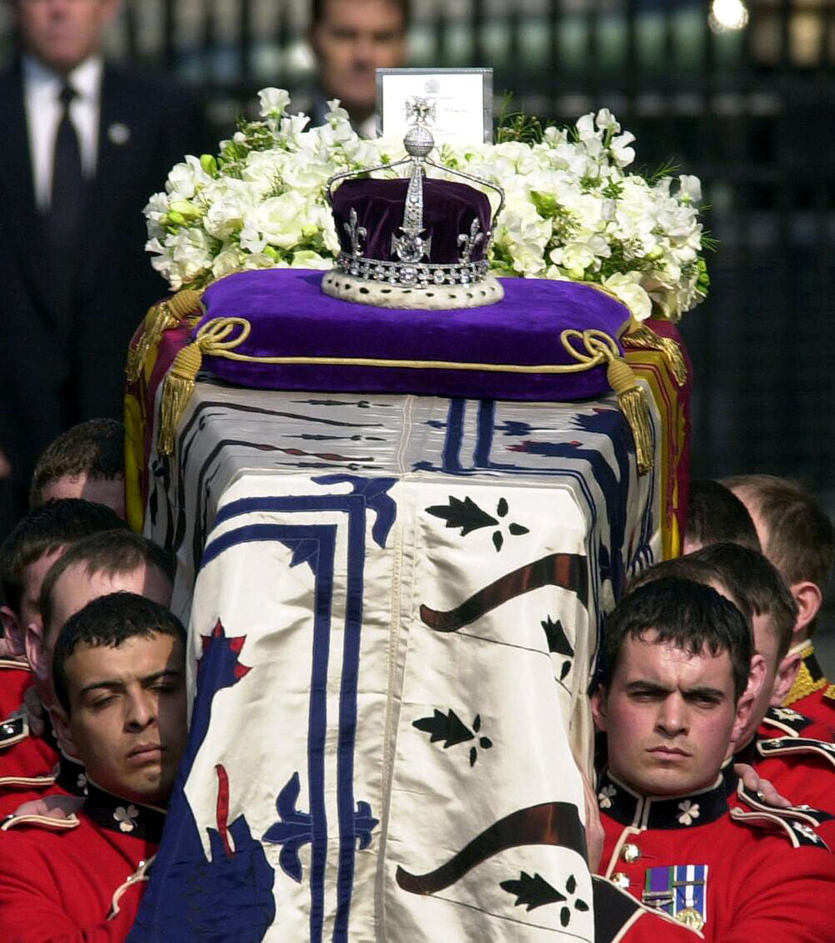 This file photo taken on April 5, 2002 shows the Crown Jewels atop the standard-draped coffin of Queen Elizabeth the Queen Mother as it is taken out of Queen`s Chapel, St. James` Palace, in central London, carried by soldiers of the Royal Irish Guards, on its way to Westminster Hall. Photo: AFP