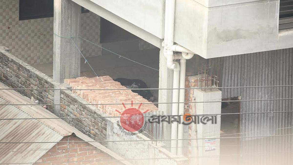 A woman lay injured inside the building in Ashkona where the law enforcers conduct a raid on 24 December. Photo: Prothom Alo