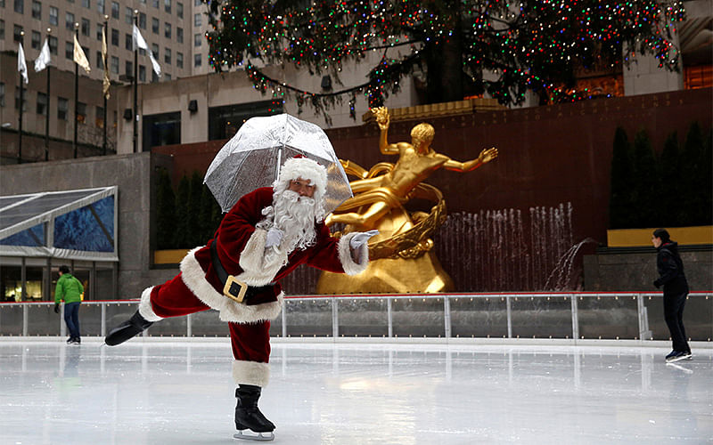 A man dressed as Santa Claus ice skates at The Rink At Rockefeller Center on Christmas Eve in Manhattan, New York City, US. Photo: Reuters