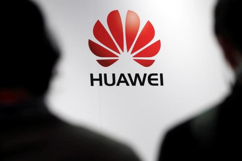 Journalists attend the presentation of the Huawei's new smartphone in Paris, 7 May, 2014. REUTERS