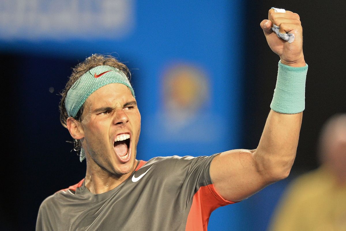 TEN160 - Melbourne, Victoria : (FILES) This file photo taken on January 24, 2014 shows Spain's Rafael Nadal celebrating his victory against Switzerland's Roger Federer during their men's singles semi-final match at the 2014 Australian Open tennis tournament in Melbourne. Spanish great Nadal will be hoping the season-opening Brisbane International gives him the chance to kick-start his career following an injury-plagued 2016. AFP