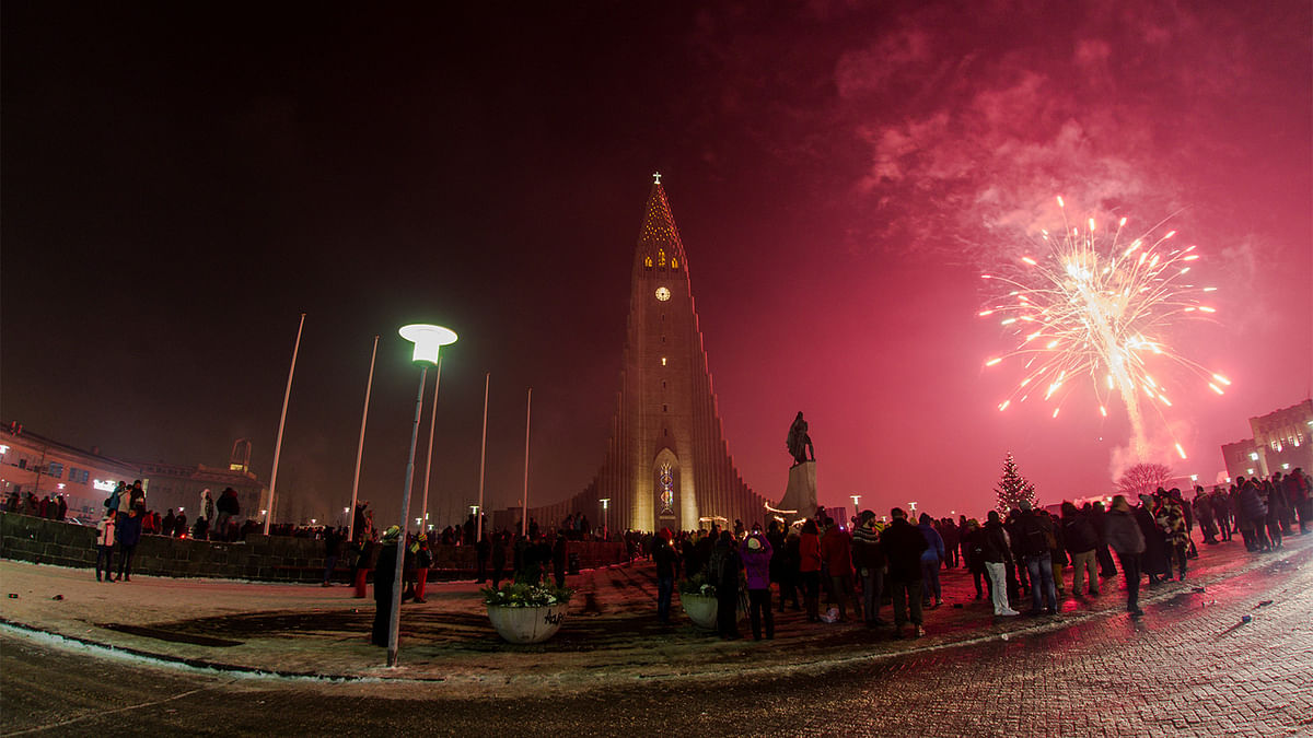 People gather at Hallgrims church to celebrate the New Year in Reykjavik, Iceland, January 1, 2017. Reuters