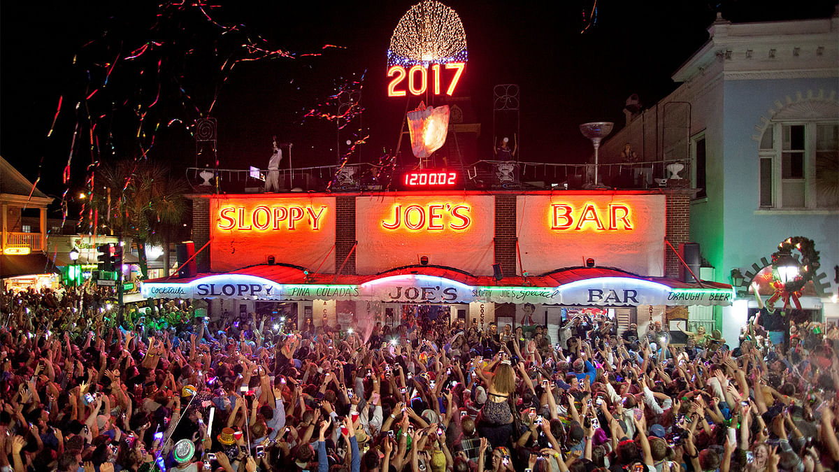 Confetti flies and New Year`s Eve revelers celebrate after a giant replica of a conch shell descended to the roof of Sloppy Joe`s Bar in Key West. Reuters