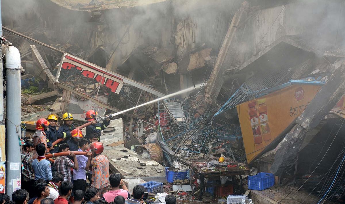 A part of the two-storey DCC market collapses in massive fire at Gulshan-1 of the capital city on Tuesday. Photo: Focus Bangla