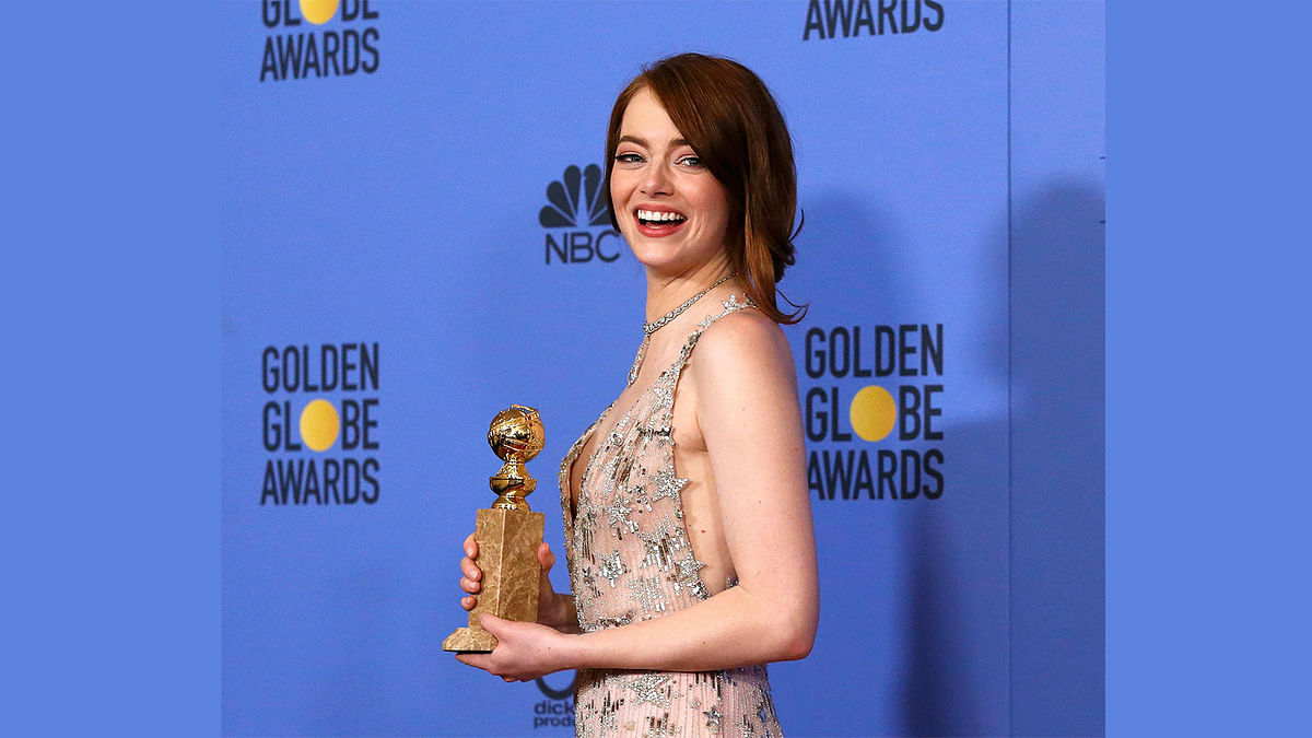 Emma Stone poses with her award for Best Performance by an Actress in a Motion Picture - Musical or Comedy for her role in `La La Land` during the 74th Annual Golden Globe Awards in Beverly Hills, California, U.S., January 8, 2017. Photo: Reuters