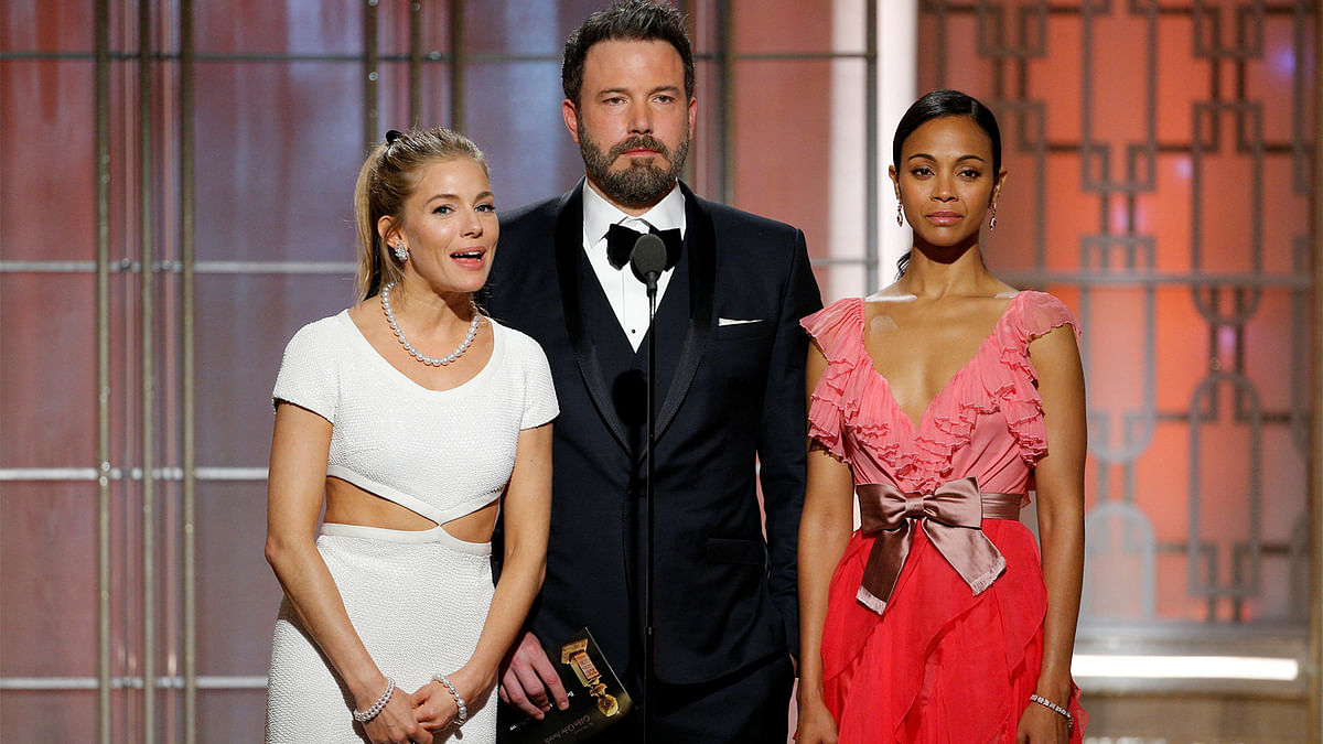 Sienna Miller (L-R), Ben Affleck, and Zoe Saldana present during the 74th Annual Golden Globe Awards show in Beverly Hills, California, U.S., January 8, 2017.