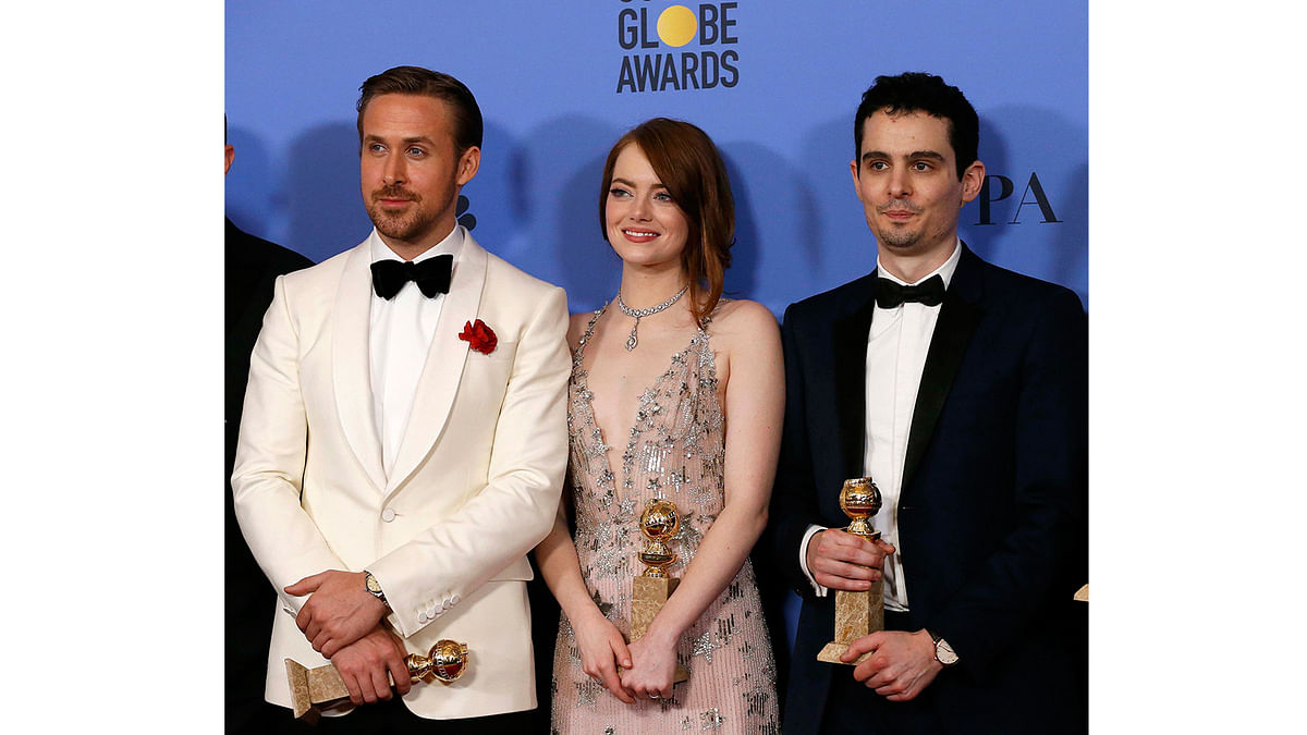 Ryan Gosling (L), Emma Stone and Damian Chazelle pose together after `La La Land` won the award for Best Motion Picture - Musical or Comedy, as well as individual awards for Best Performance by an Actor in a Motion Picture - Musical or Comedy for Gosling, Best Performance by an Actress in a Motion Picture - Musical or Comedy for Stone and Best Director - Motion Picture for Chazelle, during the 74th Annual Golden Globe Awards in Beverly Hills, California, U.S., January 8, 2017. Photo: Reuters