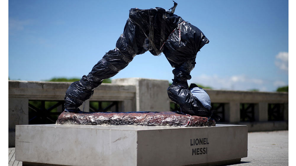 The statue of Argentina`s soccer player Lionel Messi is seen covered after it was vandalized in Buenos Aires, Argentina, January 10, 2017. Reuters