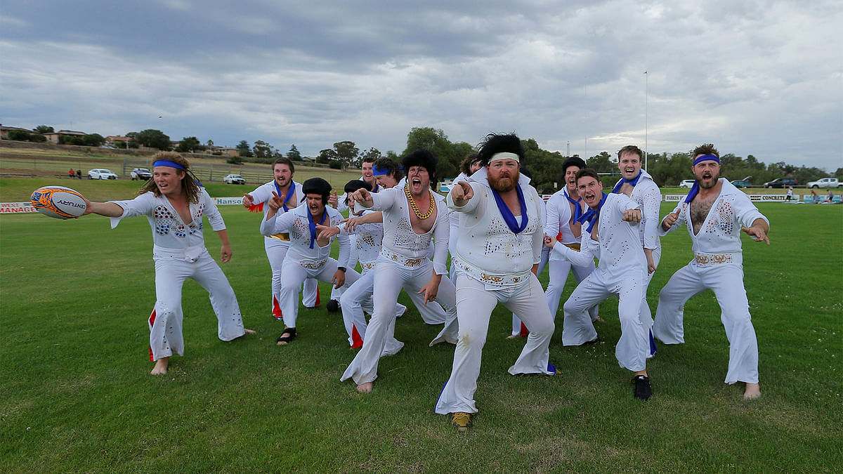 Amateur rugby players from the Blue Suede Shoes team, dressed in Elvis Presley suits, perform a haka prior to their rugby union game against the Reddy Teddies during the 25th annual Parkes Elvis Festival in the rural Australian town of Parkes, west of Sydney, Australia January 13, 2017. Photo: Reuters