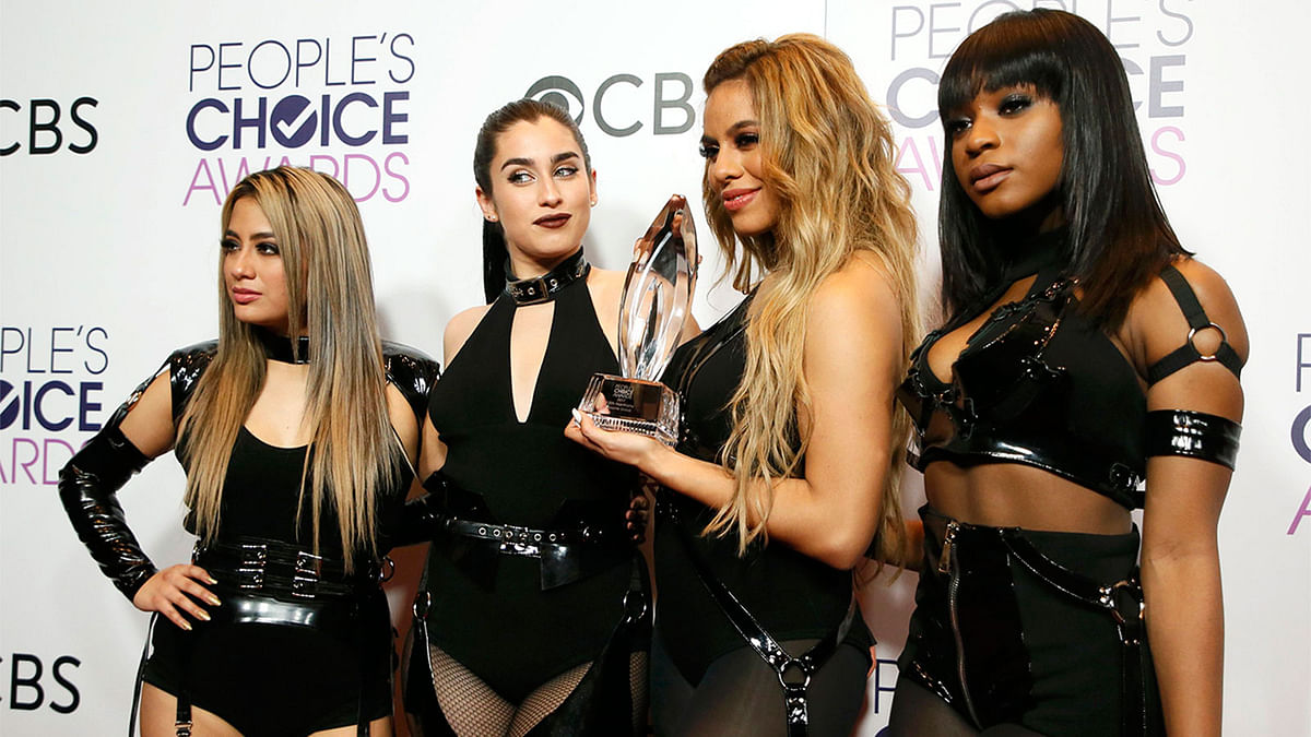 Members of Fifth Harmony pose with their award for Favorite Band backstage at the People`s Choice Awards 2017 in Los Angeles, California, U.S., January 18, 2017. Reuters