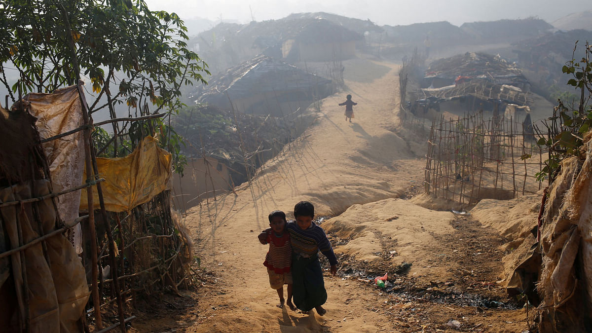 Rohingya refugee children walk in the morning at Kutupalang Unregistered Refugee Camp, in Cox`s Bazar, Bangladesh, February 4, 2017. Reuters