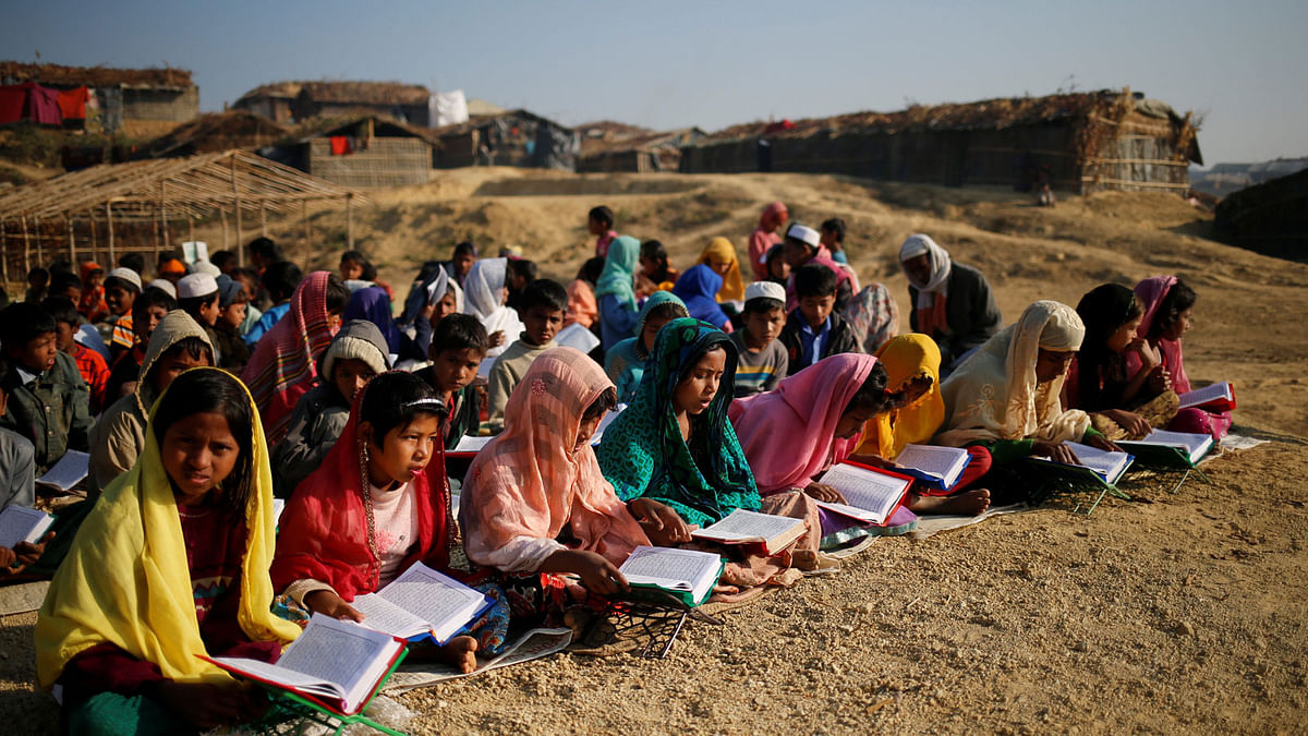 Rohingya refugee children attend an open air Arabic school at Kutupalang Unregistered Refugee Camp, where they learn to read the Quran, in Cox`s Bazar, Bangladesh, February 4, 2017. Reuters