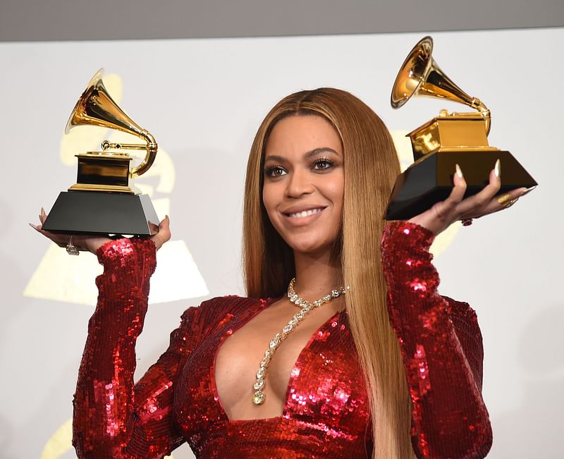 Singer Beyonce poses with her Grammy trophies in the press room during the 59th Annual Grammy music Awards on 12 February, 2017, in Los Angeles, California. Photo: AFP